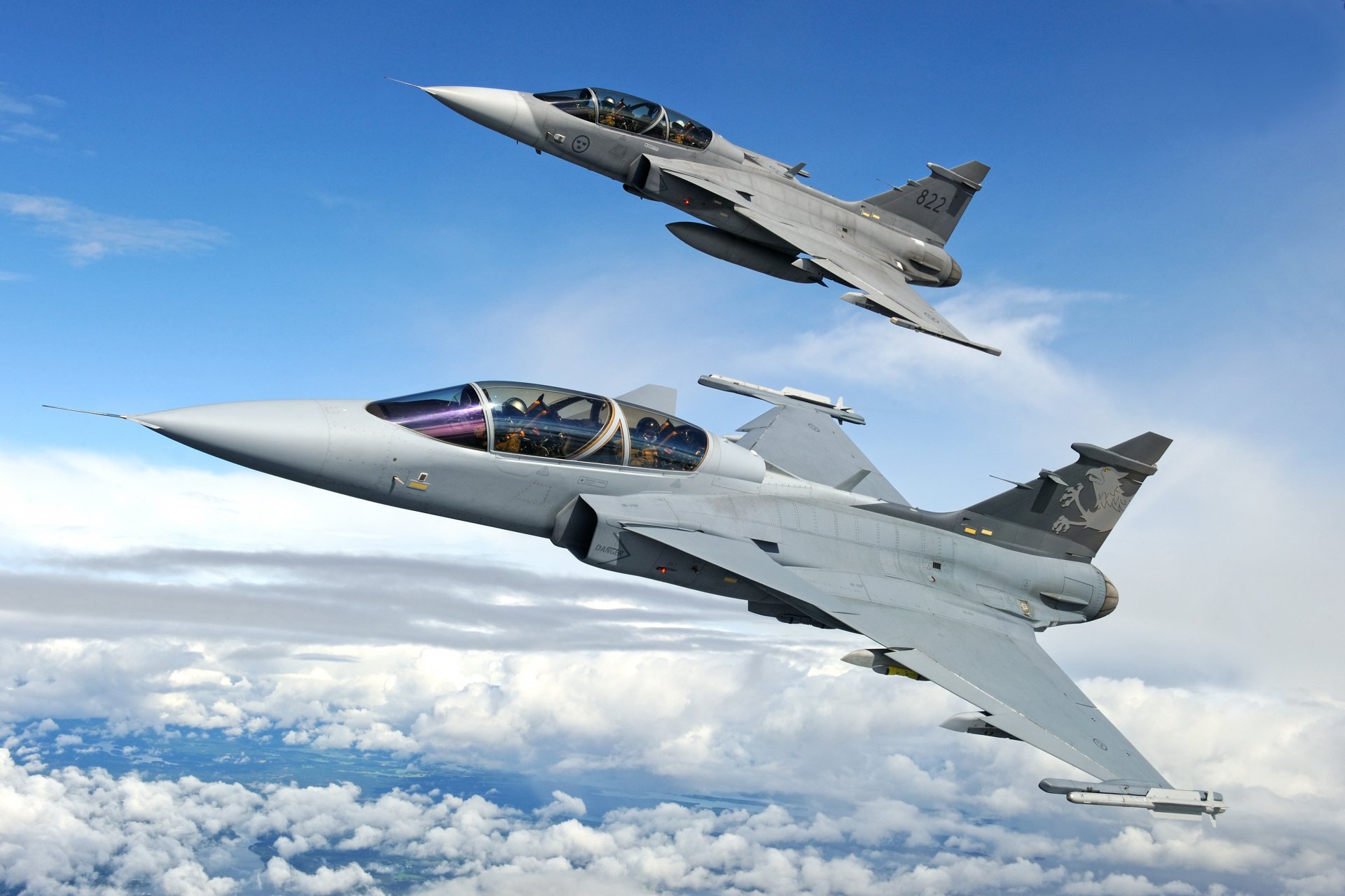 Two JAS 39 Gripen fighter jets of the Swedish Air Force in formation flight